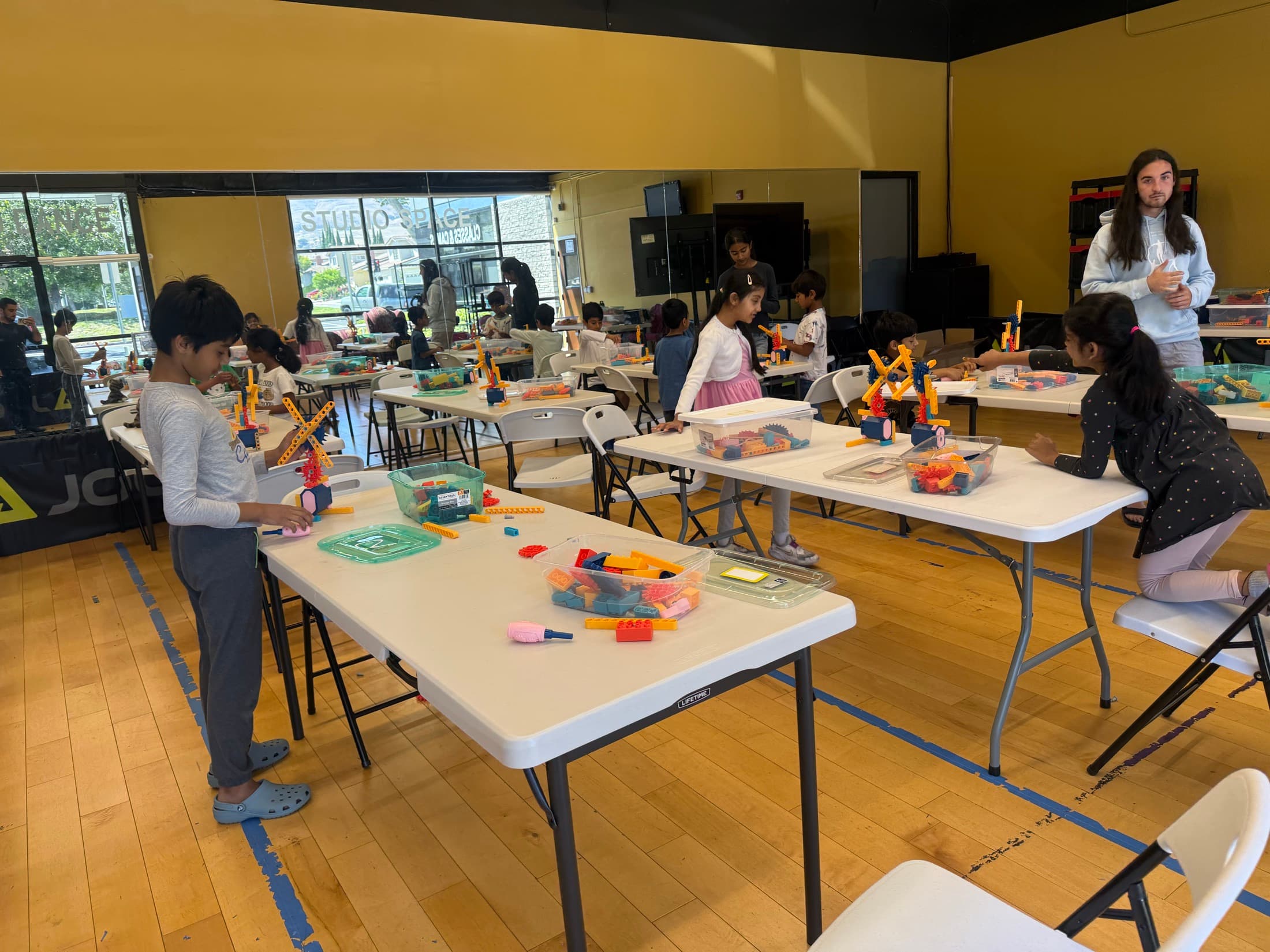 Children building and testing creative structures together